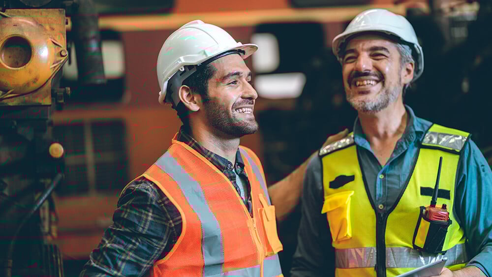 two metrology service workers in a warehouse